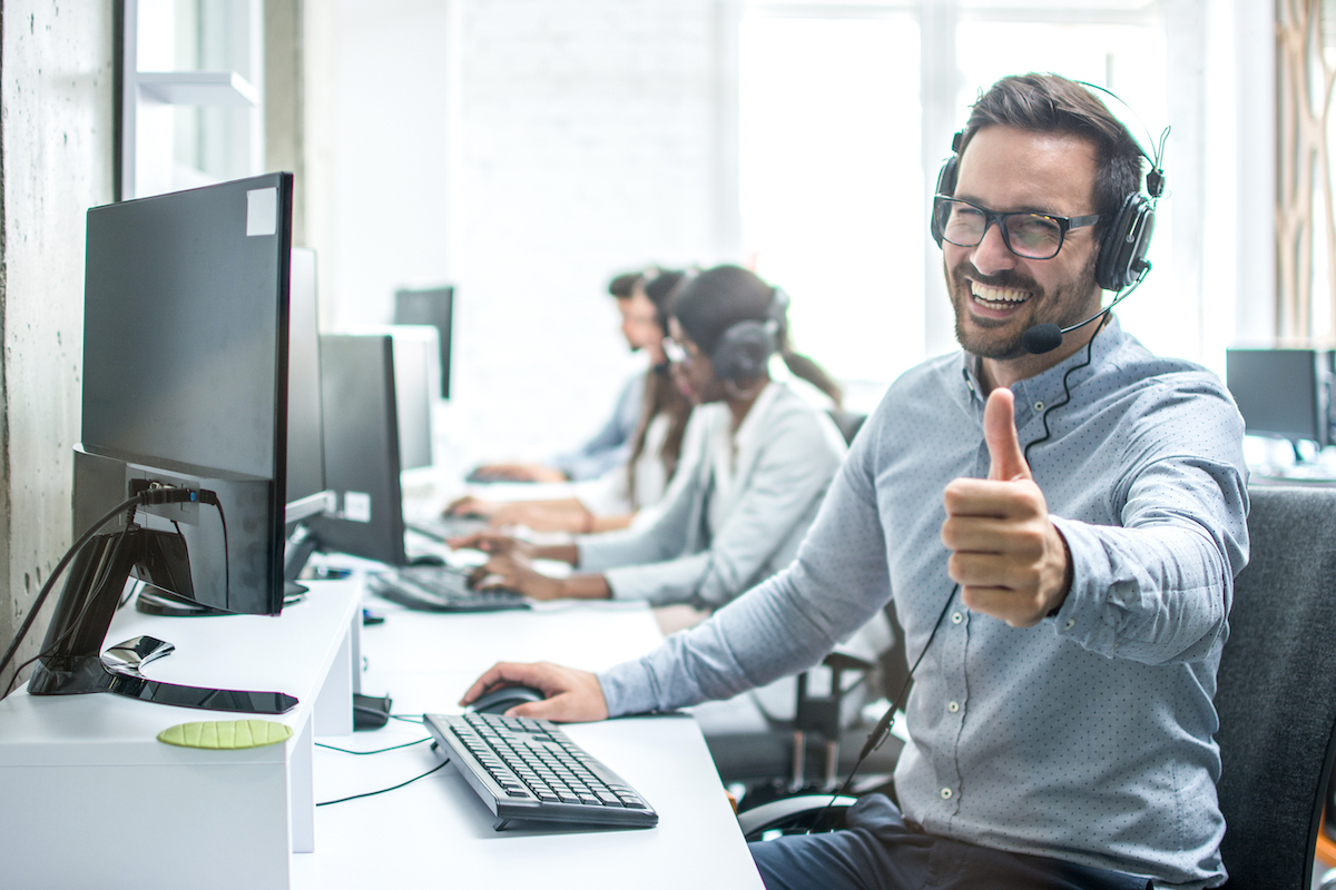 using a professional voice over will strengthen your brand: image of call centre agent